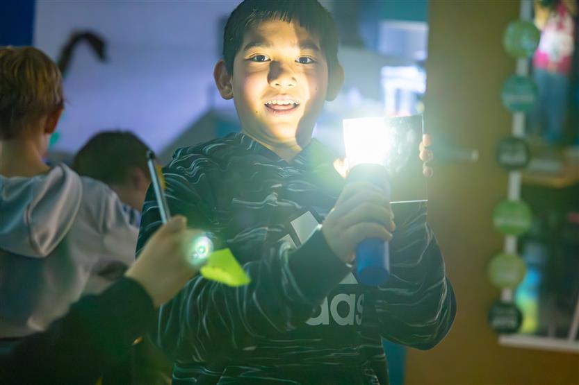 Elementary students doing a light lab